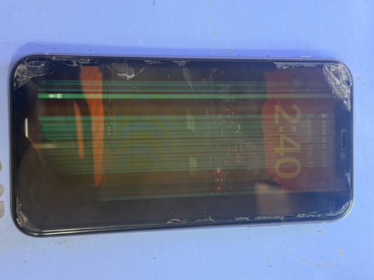 Cracked iPhone screen with green lines on repair workbench at Franchitti's Fix San Diego